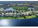 Aerial view of lakeside neighborhood highlighting backyard and a glimpse of a community pool at 4617 Garden Arbor Way, Bradenton, FL 34203