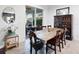 View of the dining table, with chairs, mirror and outdoor view at 4617 Garden Arbor Way, Bradenton, FL 34203