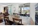 Elegant dining room with stylish table, chairs, and a sliding glass door leading to the outdoor space at 4617 Garden Arbor Way, Bradenton, FL 34203