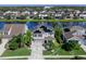 Two-story home with solar panels on roof, well-manicured lawn, and clean landscaping at 4617 Garden Arbor Way, Bradenton, FL 34203