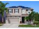 Beautiful two-story home featuring a two car garage, manicured landscaping and solar panels at 4617 Garden Arbor Way, Bradenton, FL 34203