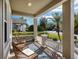 Inviting front porch with chairs, providing a cozy outdoor seating area at 4617 Garden Arbor Way, Bradenton, FL 34203