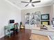 Bright home office with hardwood floors, built-in shelving and a desk with computer at 4617 Garden Arbor Way, Bradenton, FL 34203