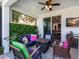 Inviting outdoor patio with comfortable seating around a fire pit, perfect for relaxing and entertaining at 4617 Garden Arbor Way, Bradenton, FL 34203