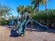 Community playground with multiple slides, bars, and climbing features for neighborhood families to enjoy at 4617 Garden Arbor Way, Bradenton, FL 34203