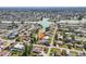 Aerial view of a neighborhood on the water with many homes and green lawns at 494 E Shade Dr, Venice, FL 34293