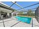 Outdoor screened pool with poolside seating and lush landscaping at 494 E Shade Dr, Venice, FL 34293