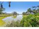 Beautiful water view showcasing the canal running behind several homes in the community at 494 E Shade Dr, Venice, FL 34293