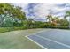 Outdoor basketball court featuring well-maintained surface and green space in a lush community at 4969 Creekside Trl, Sarasota, FL 34243