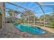 Screened in pool overlooking the lake at 4969 Creekside Trl, Sarasota, FL 34243