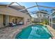 Screened-in pool with a seating area and a view of the house at 4969 Creekside Trl, Sarasota, FL 34243