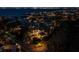 Nighttime aerial view of a luxury estate with illuminated landscaping and waterfront access at 500 Harbor Point Rd, Longboat Key, FL 34228