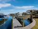 Private boat dock with boat lift and stunning views of surrounding luxury homes at 500 Harbor Point Rd, Longboat Key, FL 34228