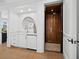 A well-lit elevator room featuring a wet bar and rich wood elevator at 500 Harbor Point Rd, Longboat Key, FL 34228