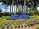 A welcoming sign displays 'The Resort at Longboat Key Club' with meticulously landscaped flowers and palm trees at 500 Harbor Point Rd, Longboat Key, FL 34228