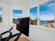 Exercise room featuring a treadmill and picturesque water views from the windows at 500 Harbor Point Rd, Longboat Key, FL 34228