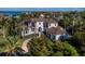 Beautiful waterfront estate featuring lush landscaping and impressive architectural details at 500 Harbor Point Rd, Longboat Key, FL 34228