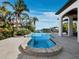 Inviting pool surrounded by manicured landscaping and stunning waterfront views at 500 Harbor Point Rd, Longboat Key, FL 34228