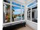 Bright sitting area with large windows showcasing a pool and canal view at 500 Harbor Point Rd, Longboat Key, FL 34228