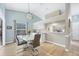 Bright dining area with light-toned wood floors and modern light fixture at 5041 Barrington Cir # 802, Sarasota, FL 34234