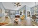 Light and airy living room with vaulted ceiling and hardwood floors at 5041 Barrington Cir # 802, Sarasota, FL 34234