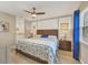 Spacious main bedroom with a king-size bed and ensuite bathroom at 5041 Barrington Cir # 802, Sarasota, FL 34234