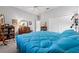 Bedroom featuring a ceiling fan, closet doors, and natural lighting at 5155 Cantabria Crest, Sarasota, FL 34238