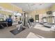 Well-equipped gym with weight machines, free weights, treadmills, and mirrored walls at 5155 Cantabria Crest, Sarasota, FL 34238