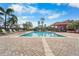 Expansive swimming pool with brick paver deck, lounge chairs and manicured landscaping at 5155 Cantabria Crest, Sarasota, FL 34238