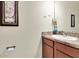 Bathroom featuring laminate counters and a decorative mirror at 5718 Broad River Run, Ellenton, FL 34222