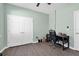 Green-painted bedroom featuring a ceiling fan and a double door closet at 5718 Broad River Run, Ellenton, FL 34222