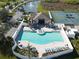 Aerial view of the community pool, clubhouse, and tennis courts, perfect for recreation at 5718 Broad River Run, Ellenton, FL 34222