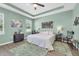 Relaxing main bedroom features a tray ceiling, a ceiling fan, and recessed lighting at 5718 Broad River Run, Ellenton, FL 34222