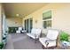 Covered lanai with comfortable seating, perfect for outdoor relaxation at 5718 Broad River Run, Ellenton, FL 34222