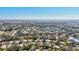 Expansive aerial view of a community with mature trees, well-maintained homes, and natural Florida landscaping at 5718 Garden Lakes Palm, Bradenton, FL 34203