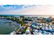 Aerial shot of colorful buildings on Anna Maria Island with street parking and docks nearby at 5718 Garden Lakes Palm, Bradenton, FL 34203