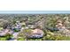 Beautiful aerial view of the home and its peaceful surroundings with mature trees at 5718 Garden Lakes Palm, Bradenton, FL 34203