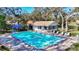 A clean community swimming pool with plenty of seating and a poolside cabana at 5718 Garden Lakes Palm, Bradenton, FL 34203