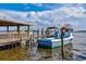 Charming dockside scene featuring a fishing boat named 'Finest Kind' with weathered wood and calm water at 5718 Garden Lakes Palm, Bradenton, FL 34203