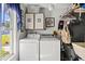 An interior shot of the laundry room, equipped with updated machines and natural light at 5718 Garden Lakes Palm, Bradenton, FL 34203