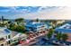 A vibrant street view of Anna Maria Island with colorful buildings, shops, and parked cars at 5718 Garden Lakes Palm, Bradenton, FL 34203