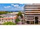 This aerial shows a street view with lush trees and views of the bay at 5718 Garden Lakes Palm, Bradenton, FL 34203