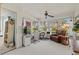 Bright and airy sun room featuring multiple windows, a ceiling fan, and versatile living space at 5718 Garden Lakes Palm, Bradenton, FL 34203