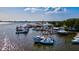 Waterfront scene highlighting boats, docks, and waterside buildings, capturing the essence of a vibrant harbor on a clear day at 5718 Garden Lakes Palm, Bradenton, FL 34203