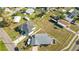 An aerial view showcasing the property's layout, the fenced backyard, proximity to the water, and surrounding neighborhood at 6001 Firefly Ln, Apollo Beach, FL 33572