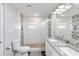 Bathroom featuring a glass door shower and white cabinets with a granite countertop at 6001 Firefly Ln, Apollo Beach, FL 33572