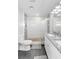 Bathroom featuring a glass door shower and white cabinets with a granite countertop at 6001 Firefly Ln, Apollo Beach, FL 33572