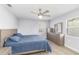 This bedroom features modern gray floors and a set of matching dresser drawers at 6001 Firefly Ln, Apollo Beach, FL 33572