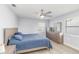 This bedroom features modern gray floors and a set of matching dresser drawers at 6001 Firefly Ln, Apollo Beach, FL 33572