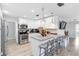 Modern kitchen with stainless steel appliances, granite counters, and a breakfast bar at 6001 Firefly Ln, Apollo Beach, FL 33572